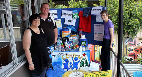 PREPARED: Melissa, Nan and Jonathon display their example of a disaster kit at Semita House. The kit was based on their experience of being in a flood and from information sourced from the Emergency Management QLD website. sg-81210-014 PREPARED: Melissa, Nan and Jonathon display their example of a disaster kit at Semita House. The kit was based on their experience of being in a flood and from information sourced from the Emergency Management QLD website. sg-81210-014